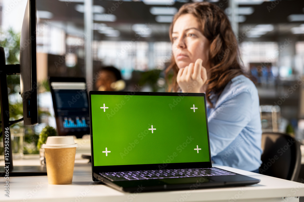 Poster focused administrator solving tasks at the office next to copy space display, using data analytics a