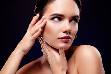 Photo portrait of attractive young woman touch skin temples lifting shoulders off isolated on black...
