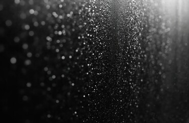 Macro view of glass surface covered with tiny water droplets creating abstract background texture. Liquid moisture reflects light, offering fresh, clean, clear, wet, shiny, silver, cool aesthetic for