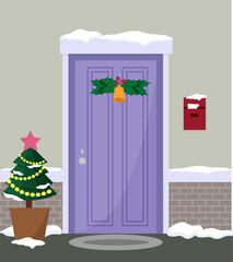 House facade with door decorated for Christmas. Decorative Christmas tree by the door. Festive winter scene and anticipation of the holiday. Garland with bell. Mailbox with newspaper on the wall of