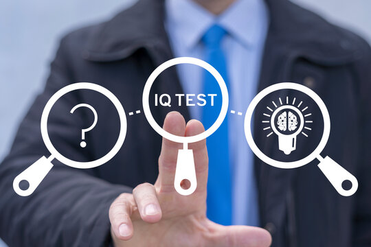 Business person using virtual touch screen push the inscription: IQ TEST. IQ Test Intelligence Quotient Business Education concept.