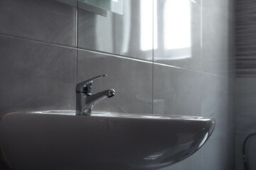 Water tap , faucet. Flow water in bathroom with sink. Modern clean hause. Hygiene concept. Panorama