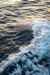 Sea water splash with foamy wave. Water surface texture. Tropical islands ferry travel. Cruiseliner...