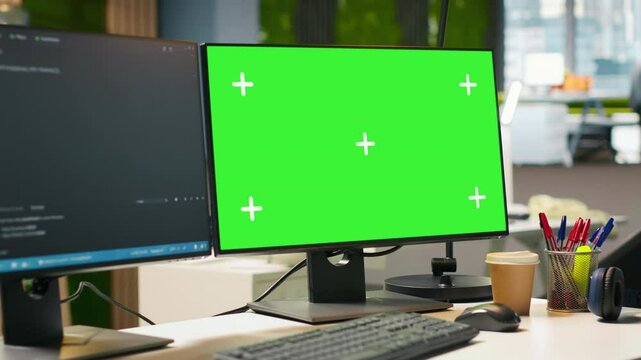Isolated screen computer monitor in modern startup office displaying code snippets in various programming languages used for application development. Mockup PC in empty software agency workspace