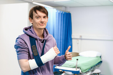 Smiling Patient With Cast Gives Thumbs Up In Hospital