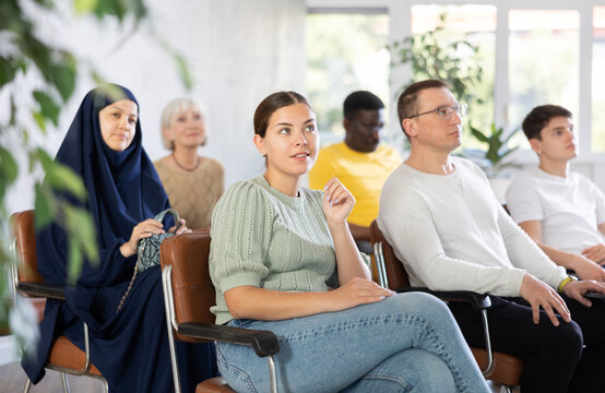 Portrait of students of different years and of different nationalities on training session in lecture hall