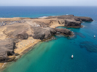 Sandy beach Playa de Papagayo aerial view from drone, Lanzarote