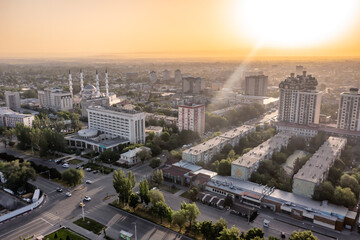 Aerial drone view of the Bishkek capital city center with a mosque, Kyrgyzstan during sunrise