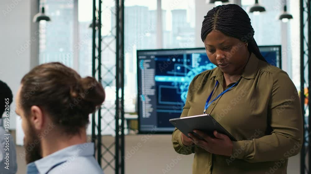 Poster happy female engineer in office automating repetitive tasks using ai scripts. jolly african american