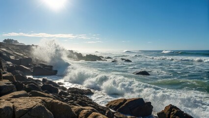 Gentle Waves Crash Against Rocky Shore Under Bright Sunny Sky