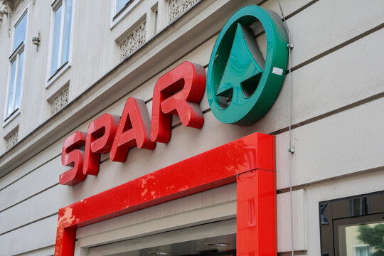 Vienna, Austria - 12. July 2025: SPAR supermarket logo is shining on a building facade in Vienna