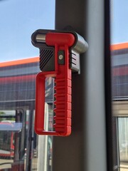 red emergency hammer in a bus