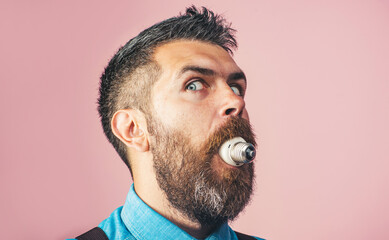 Bearded man with light bulb in mouth. Handsome man with electrical lightbulb in mouth. Energy and...