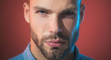 Man portrait. Closeup portrait of handsome pensive bearded man. Fashionable brutal hipster with...