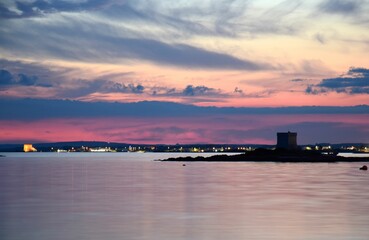 Dramatic and purple sky at sunset by the sea