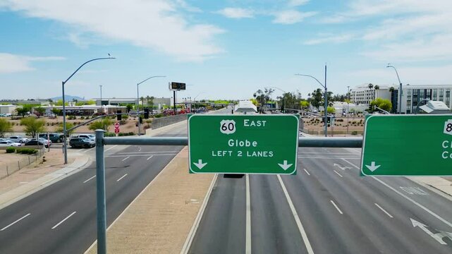 Overhead view of US-60 East highway sign directing traffic toward Globe, Arizona