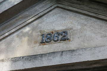 Historic building cornerstone carved with year 1862 showing architectural heritage and craftsmanship