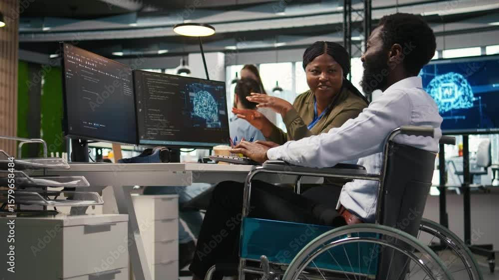 Fototapete joyous technician with disability and coworker chatting while coding ai algorithms debugging softwar