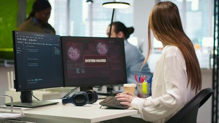 Young programmer in office requests help from IT experts detecting and blocking hacker intrusion. Intern assisted by staff members coordinating incident response for network attack, camera A - Powered by Adobe