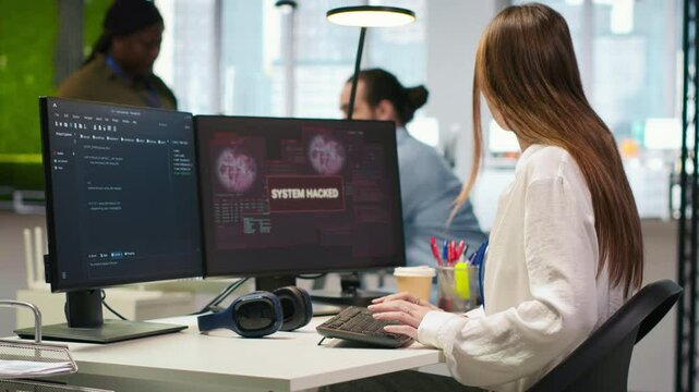 Young programmer in office requests help from IT experts detecting and blocking hacker intrusion. Intern assisted by staff members coordinating incident response for network attack, camera A