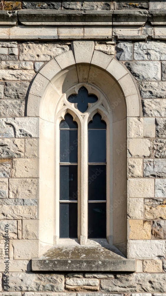 Poster arched stone window in old building with gothic design details architecture