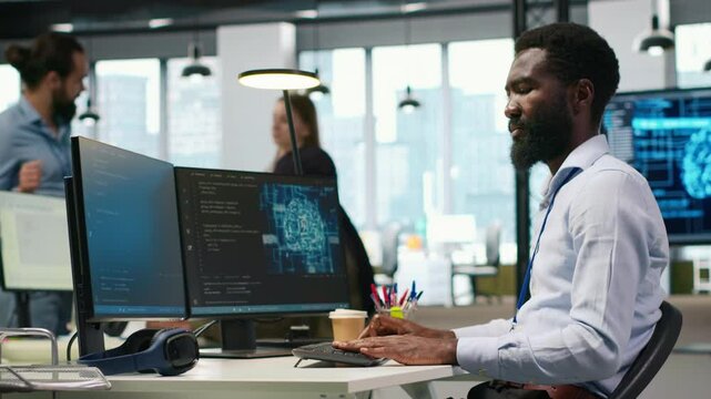 System administrator in office using PC, automating repetitive tasks with AI scripts. IT specialist using artificial intelligence technology to speed up feature implementation, camera A