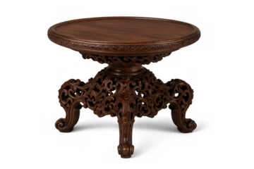 Round carved wooden table standing on transparent background, showing intricate craftsmanship and elegant design