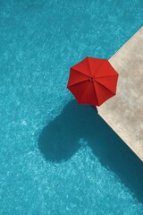 Poolside red umbrella, aerial view, tranquil scene