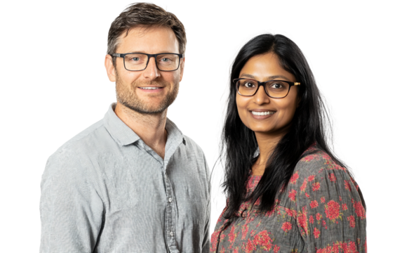 Caucasian man and South Asian woman working together on a collaborative project isolated on transparent background PNG