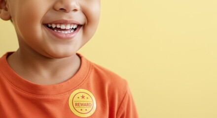 Young child smiling with reward sticker against a yellow background  