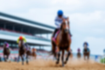 blurry racetrack, showing horses racing on a track with riders on them, blurry wallpaper.