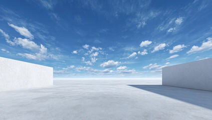 Vast open space with white walls under a clear blue sky