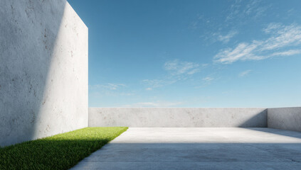 Modern concrete structure with green grass under clear blue sky