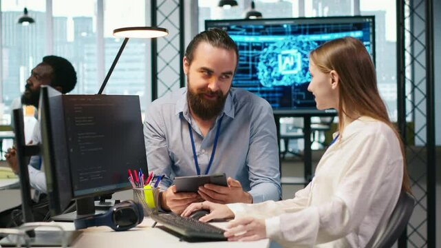 Mentor teaching young employee to troubleshoot software errors using AI. Manager doing induction to newcomer junior dev using computer to write code, developing machine learning APIs, camera A