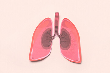 Paper lungs on beige background