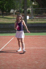 Obraz premium beautiful young woman playing tennis and possing outdoors, no edited image