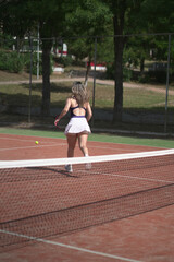 Obraz premium beautiful young woman playing tennis and possing outdoors, no edited image