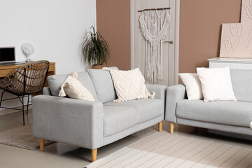 Interior of living room with modern electric fan on coffee table