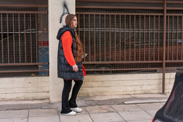 Young woman walking around the city and the parks in Autumn time.