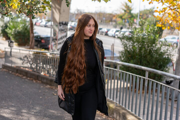 Fototapeta premium Unedited Portrait of a Young Woman Walking in the City – Facial Expressions Showing Various Emotions