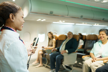 Female cabin crew is perform the flight safety demonstration before departure.