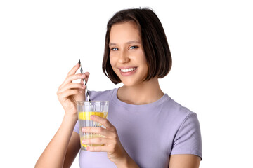 Pretty young woman with glass of infused water on white background