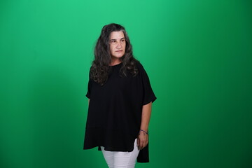 Unedited Portrait of Woman’s Face Expressing Various Emotions – Green Studio Background