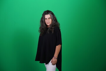 Unedited Portrait of Woman’s Face Expressing Various Emotions – Green Studio Background