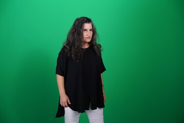 Unedited Portrait of Woman’s Face Expressing Various Emotions – Green Studio Background