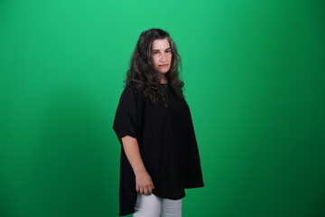 Unedited Portrait of Woman’s Face Expressing Various Emotions – Green Studio Background