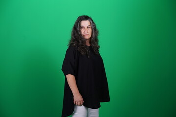 Unedited Portrait of Woman’s Face Expressing Various Emotions – Green Studio Background