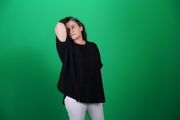 Unedited Portrait of Woman’s Face Expressing Various Emotions – Green Studio Background