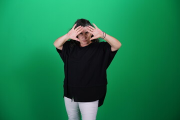Unedited Portrait of Woman’s Face Expressing Various Emotions – Green Studio Background