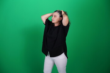 Unedited Portrait of Woman’s Face Expressing Various Emotions – Green Studio Background